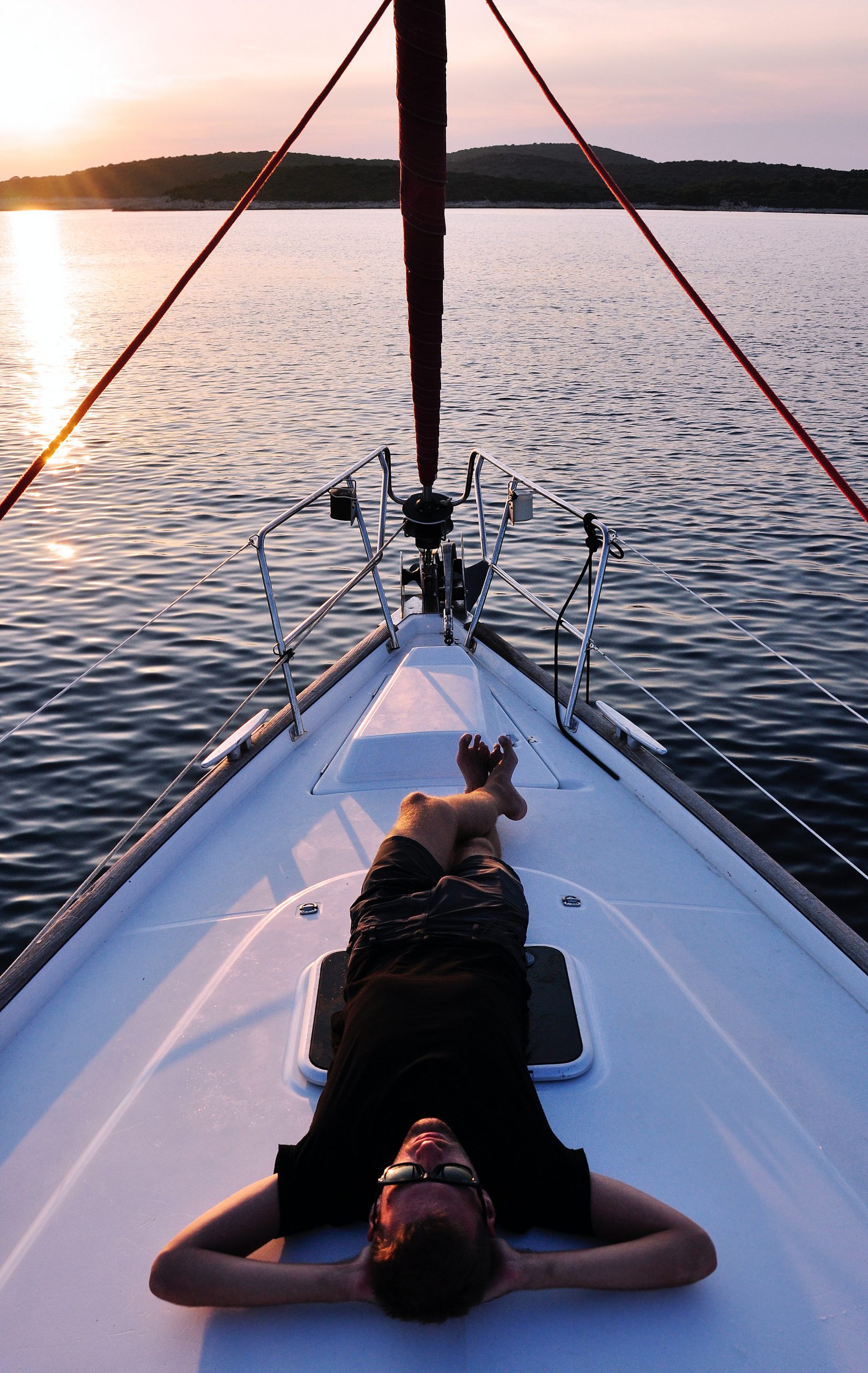 man-laying-on-deck