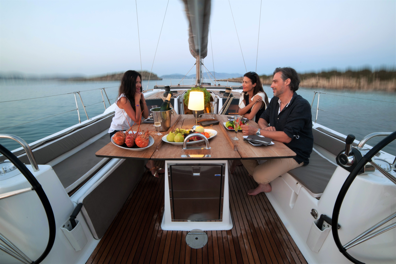 people-enjoying-dinner-on-a-yacht