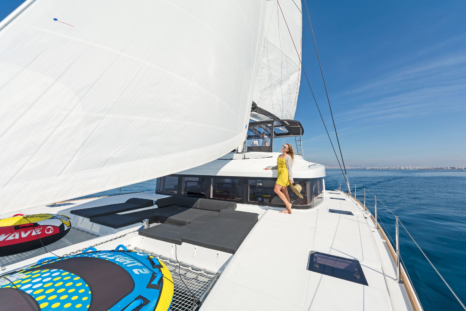 sailing-catamaran-Summer star-girl-on-front-deck