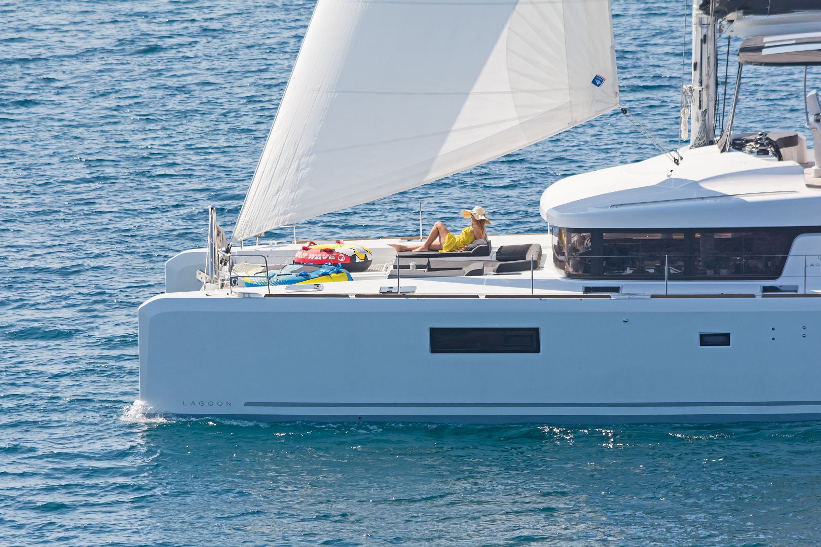 catamaran-Summer-Star-girl-laying-on-front-deck