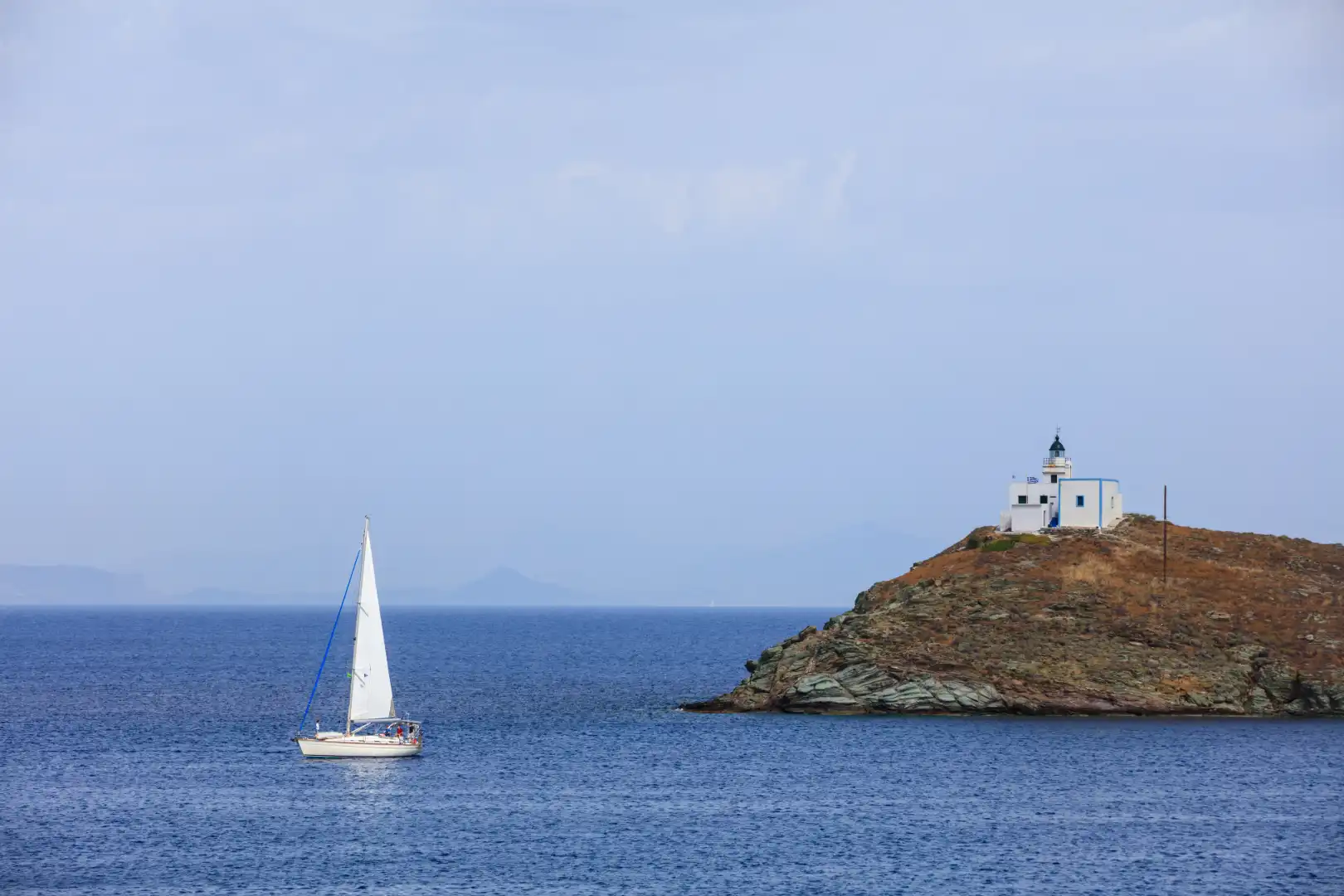Cyclades-Lighthouse -and- sailing- boat-Greece