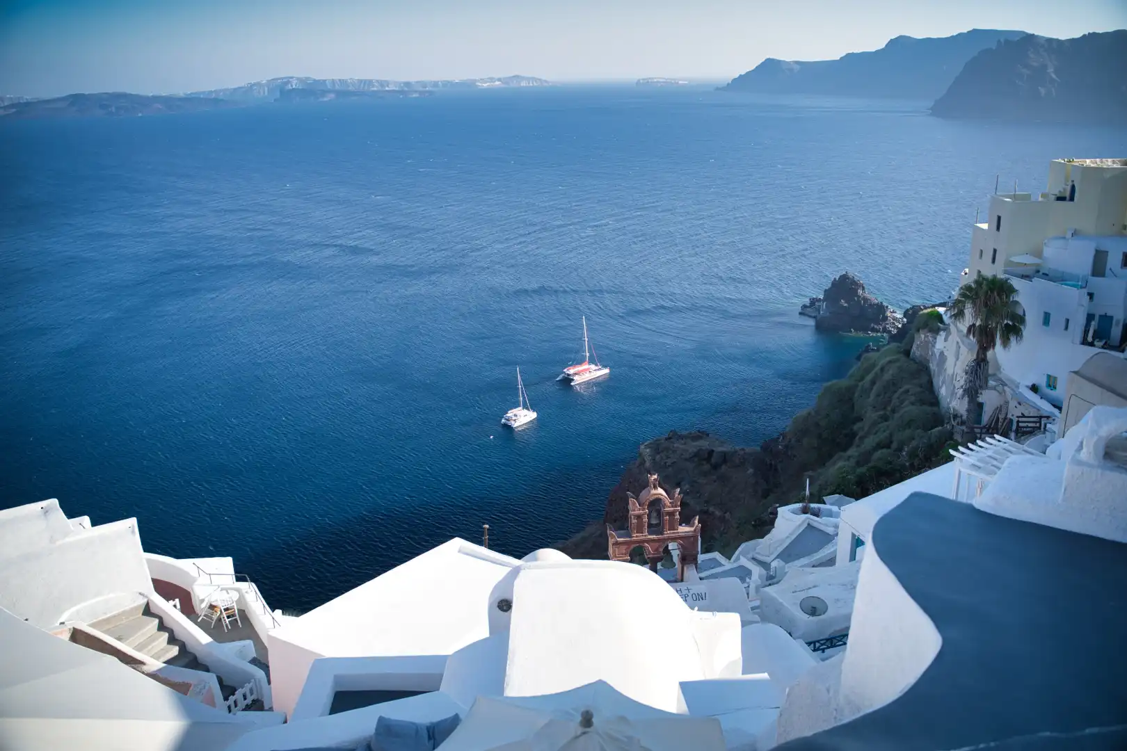Yacht-view-from-island-Santorini-in-Cyclades